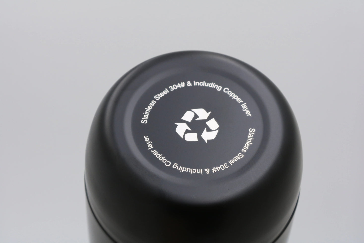 Bottom view of Bullet Bottle showing recycling symbol and stainless steel material details