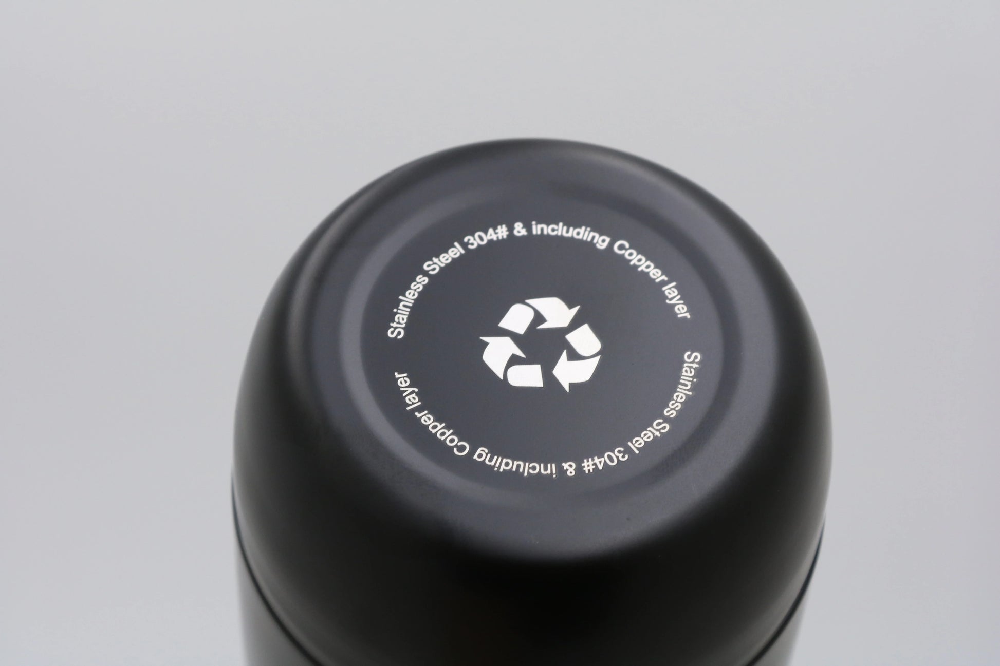 Bottom view of Bullet Bottle showing recycling symbol and stainless steel material details