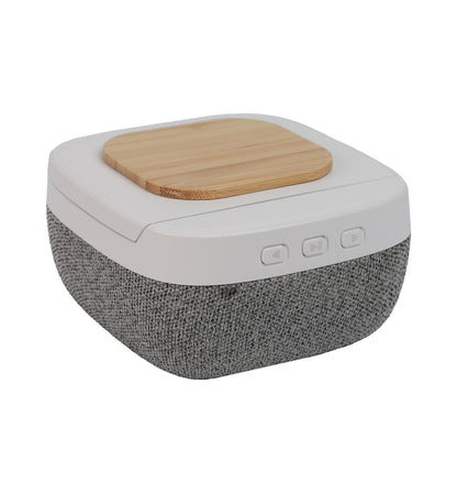 Bluetooth Speaker with Wireless Charging featuring fabric speaker body and wooden wireless charging pad with control buttons on the side