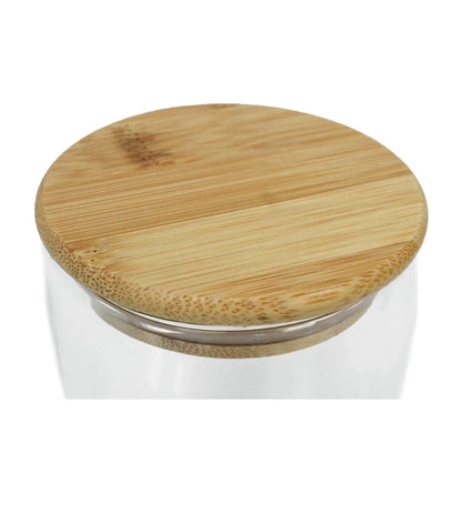 Close-up of a wooden lid on a Double Wall 350ml Glass Tumbler with a smooth natural finish and clear glass rim visible beneath.