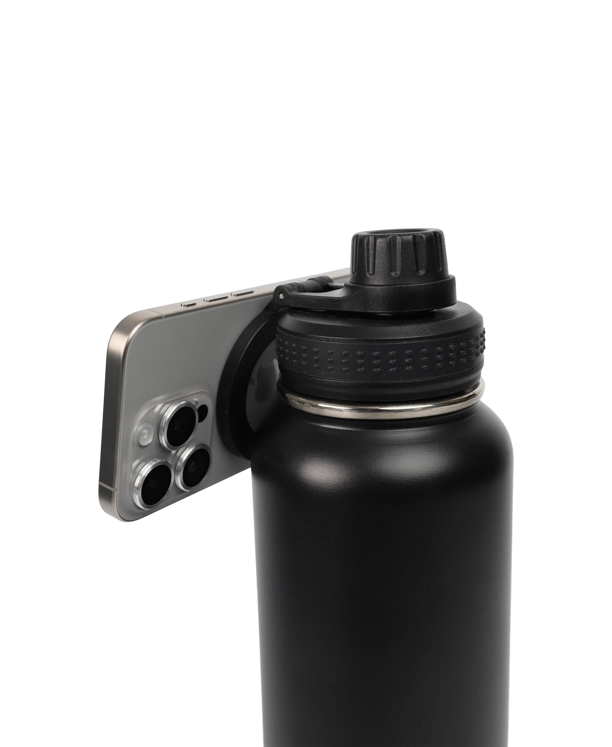 Magnetic Lid Stainless Steel Bottle in black with a phone magnetically attached to the lid, showing functionality and design.