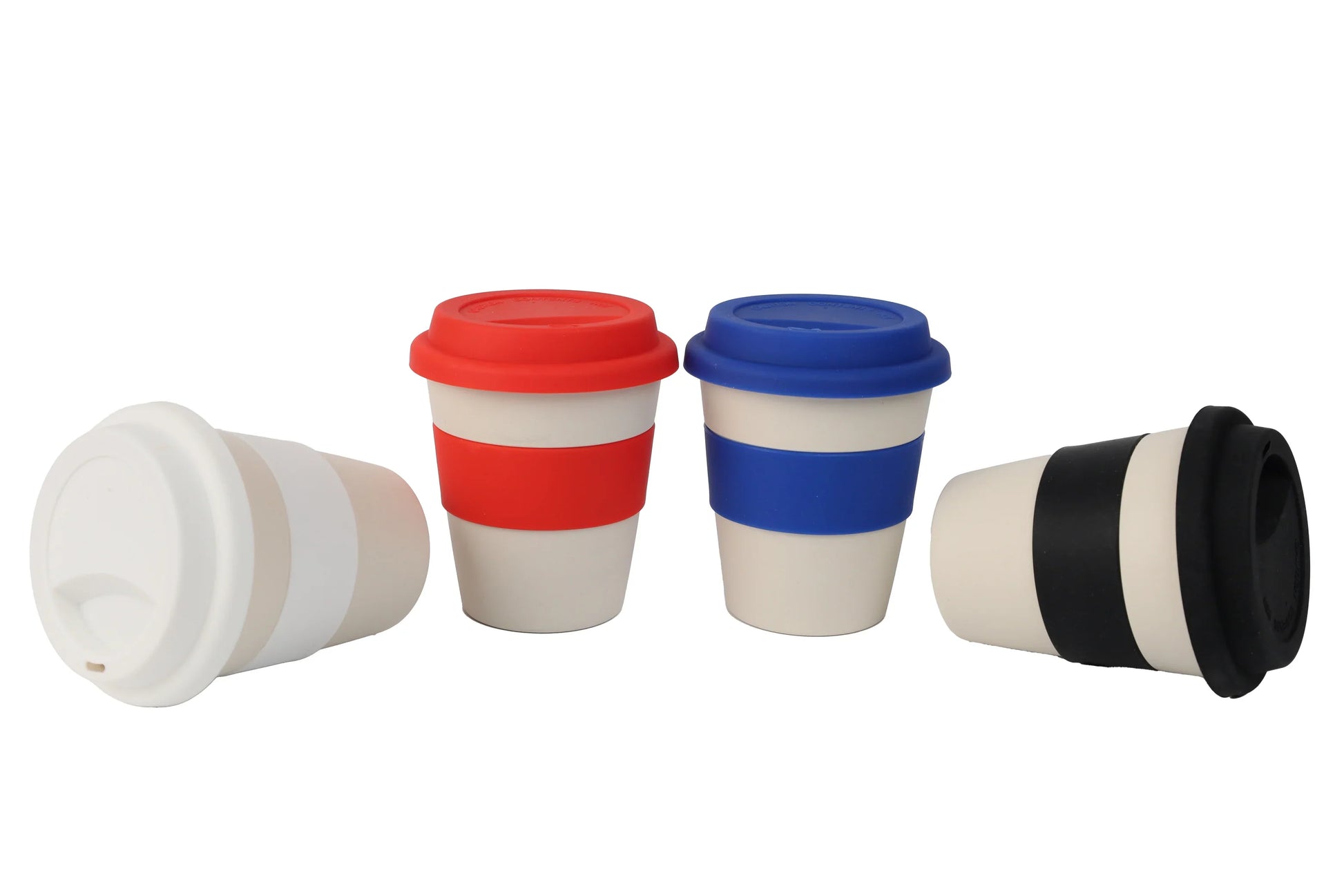 Four reusable Wheat Straw Silicon Lid Tumblers in white with removable lids in white, red, blue, and black colors.